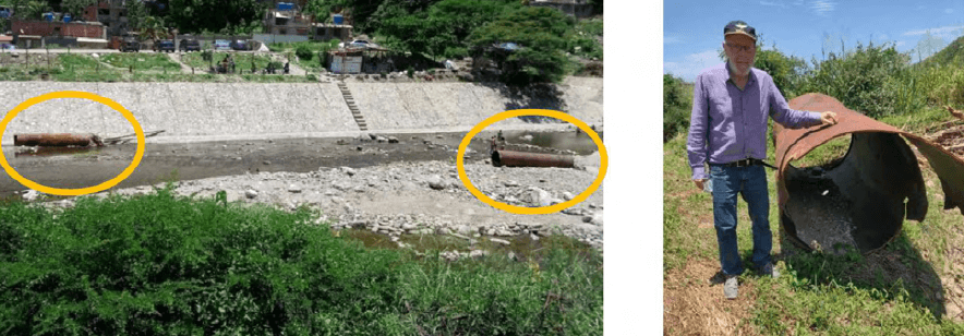 Figura 24. Restos de los tubos depositados aguas abajo en el lecho de la canalización del río Camurí Grande. El diámetro de los tubos es de 1,10 m (Foto tomada el 12/09/21).